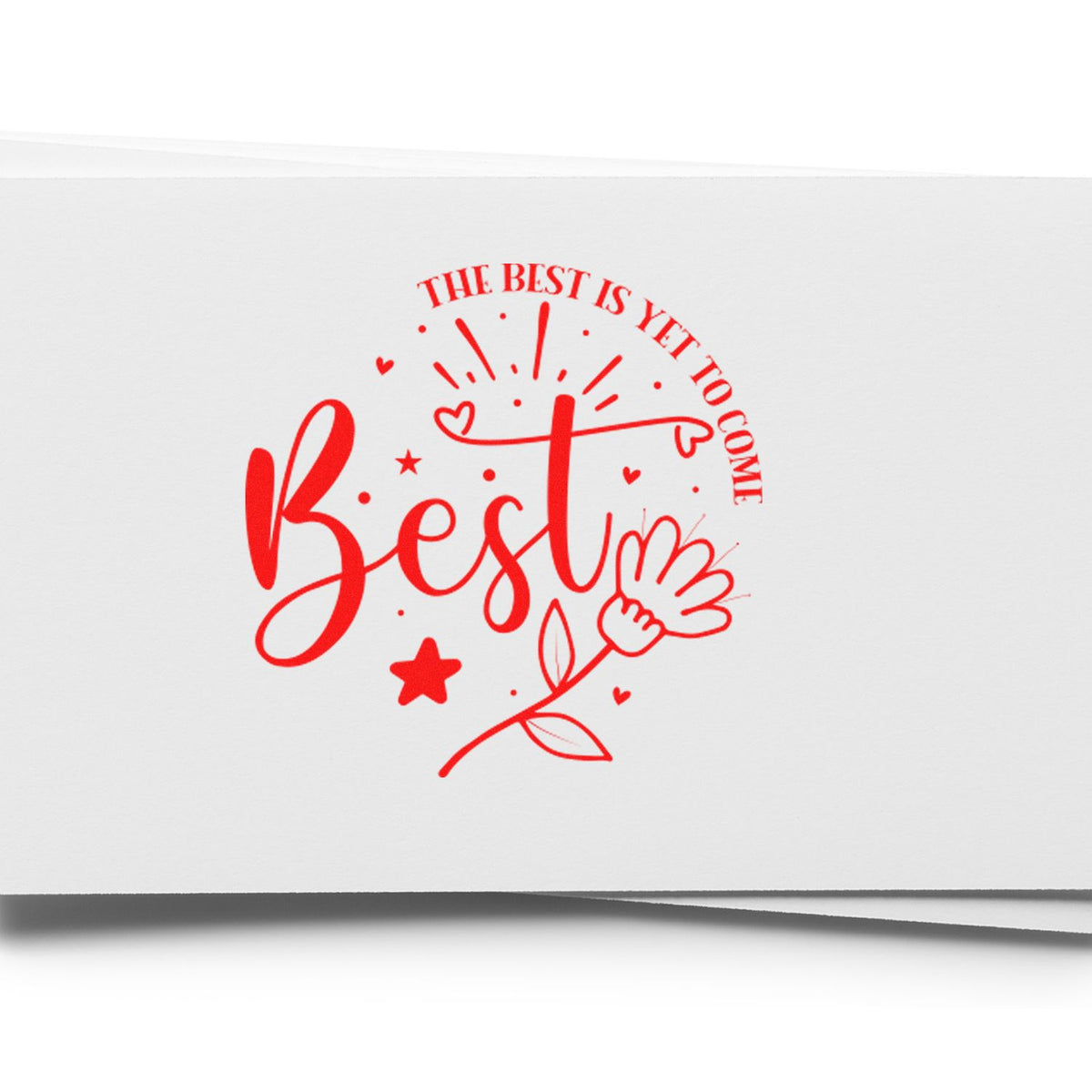 Red decorative stamp seal reading Best with hearts, star, and The best is yet to come on white paper.