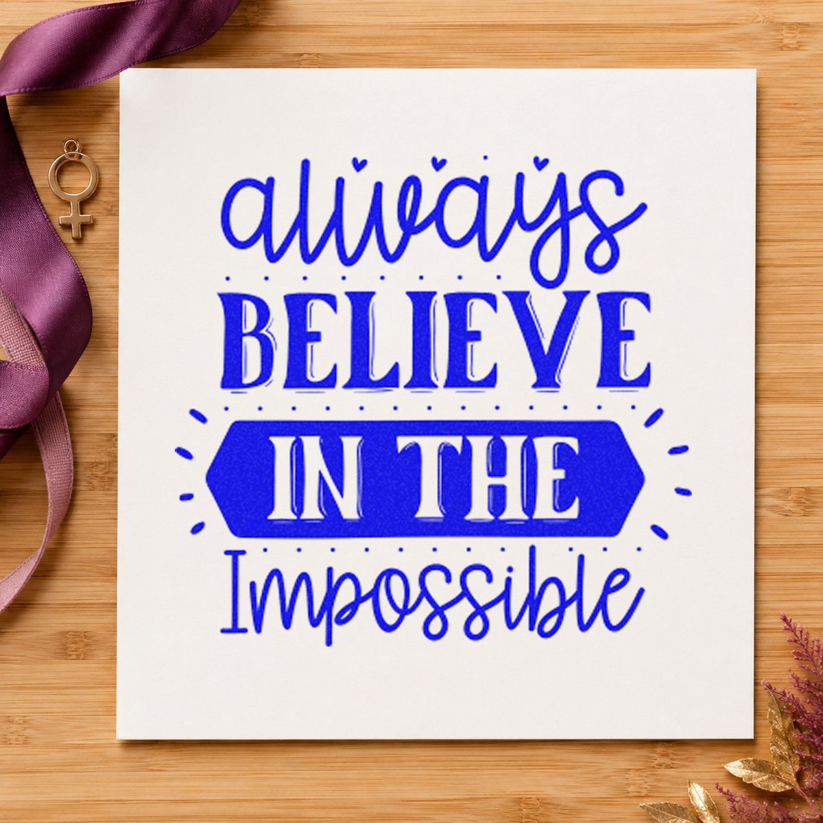 Always Believe In The Impossible craft stamp in blue ink on cardstock, an easy option for pit banner printing.