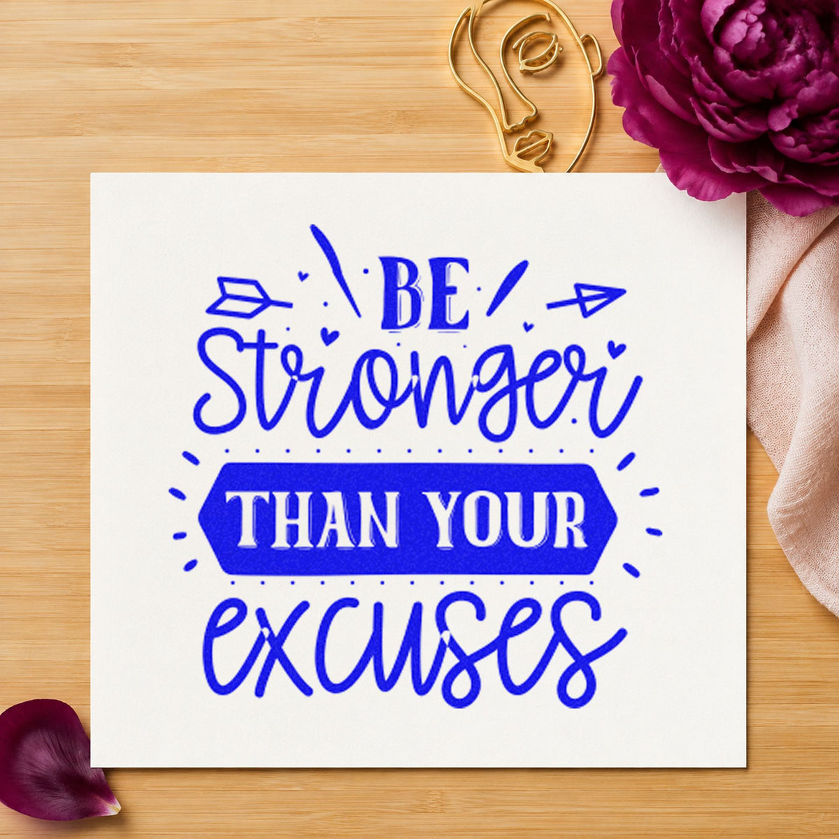 Stronger Than Your Excuses Arrows craft stamp in blue ink on cardstock, an easy option for buff band printing.