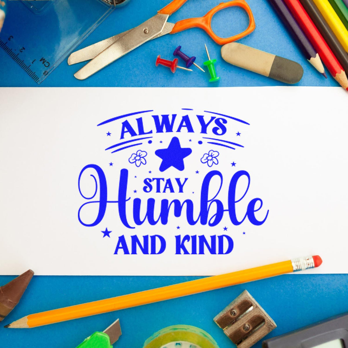 Always Stay Humble Kind Flowers rubber stamp shown in blue ink, stamped for projects such as riding album page.
