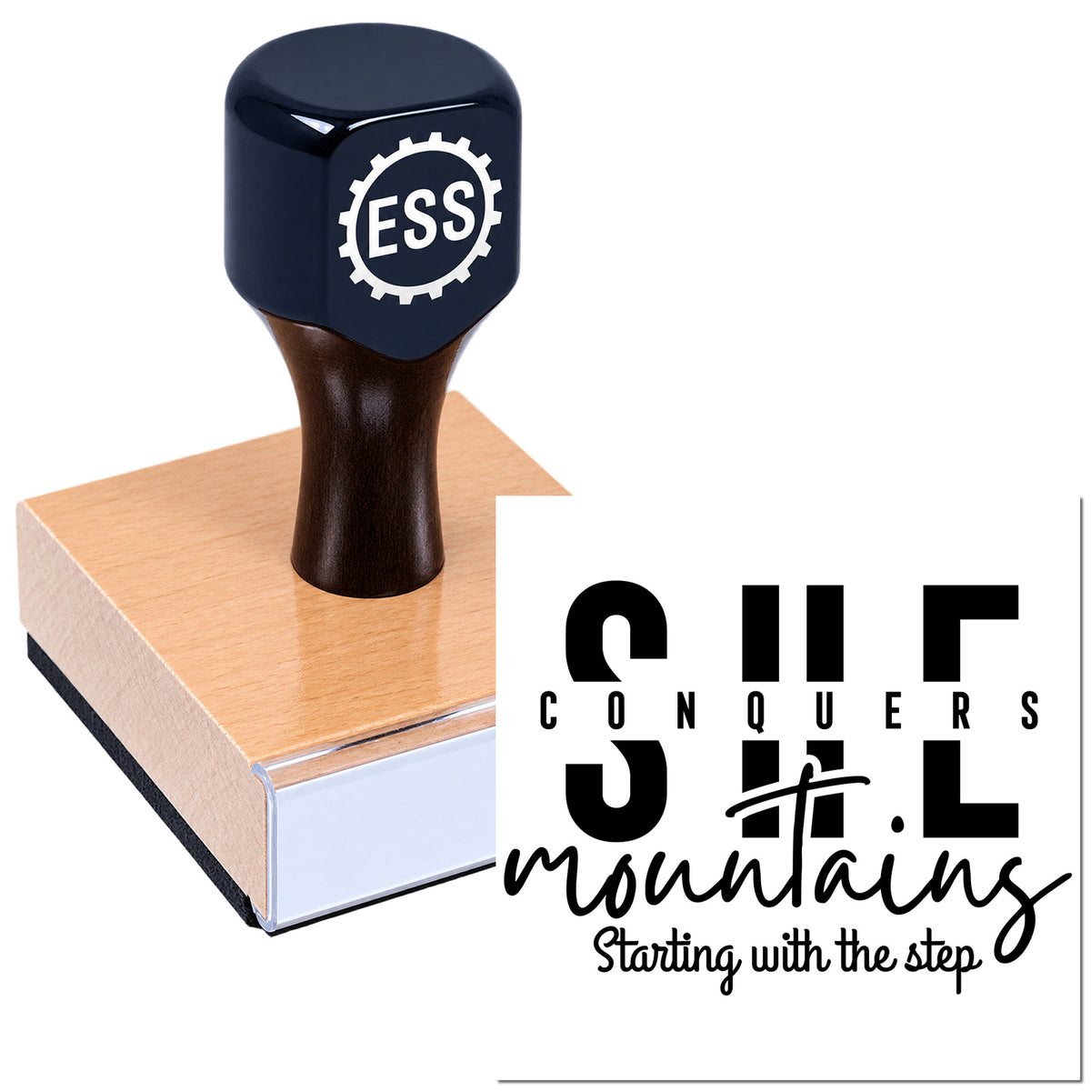 Black ESS rubber stamp with copper-colored seal base and bold "Conquers Mountains" branding on a white background.