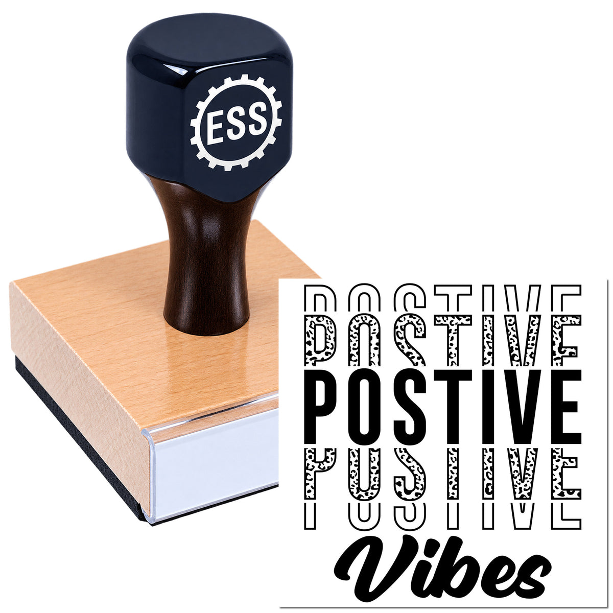 Black ESS stamp seal on wood block, pressing positive vibes design in white and black.