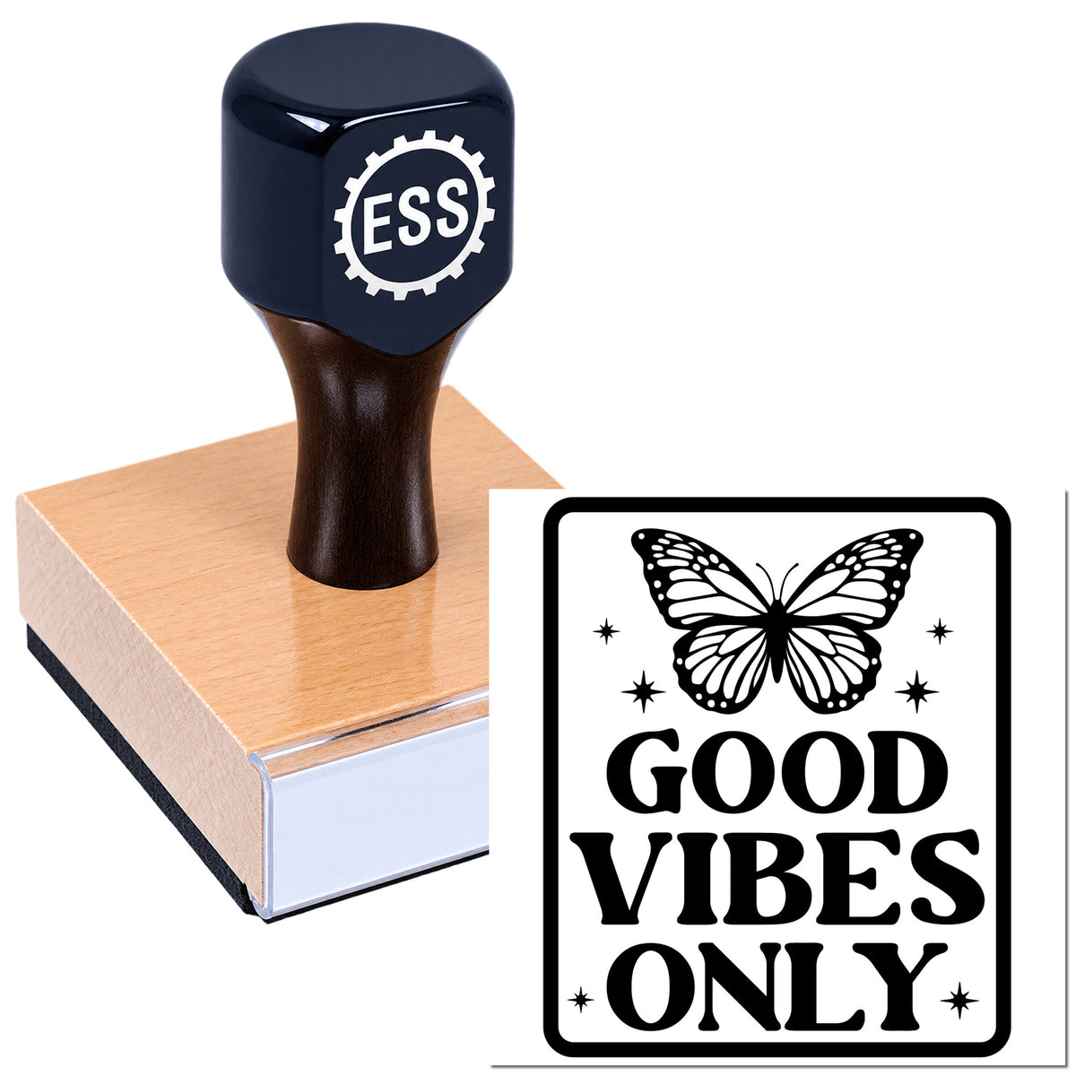 Dark blue ESS rubber stamp on a wooden seal block with butterfly "Good Vibes Only" design on a white background.