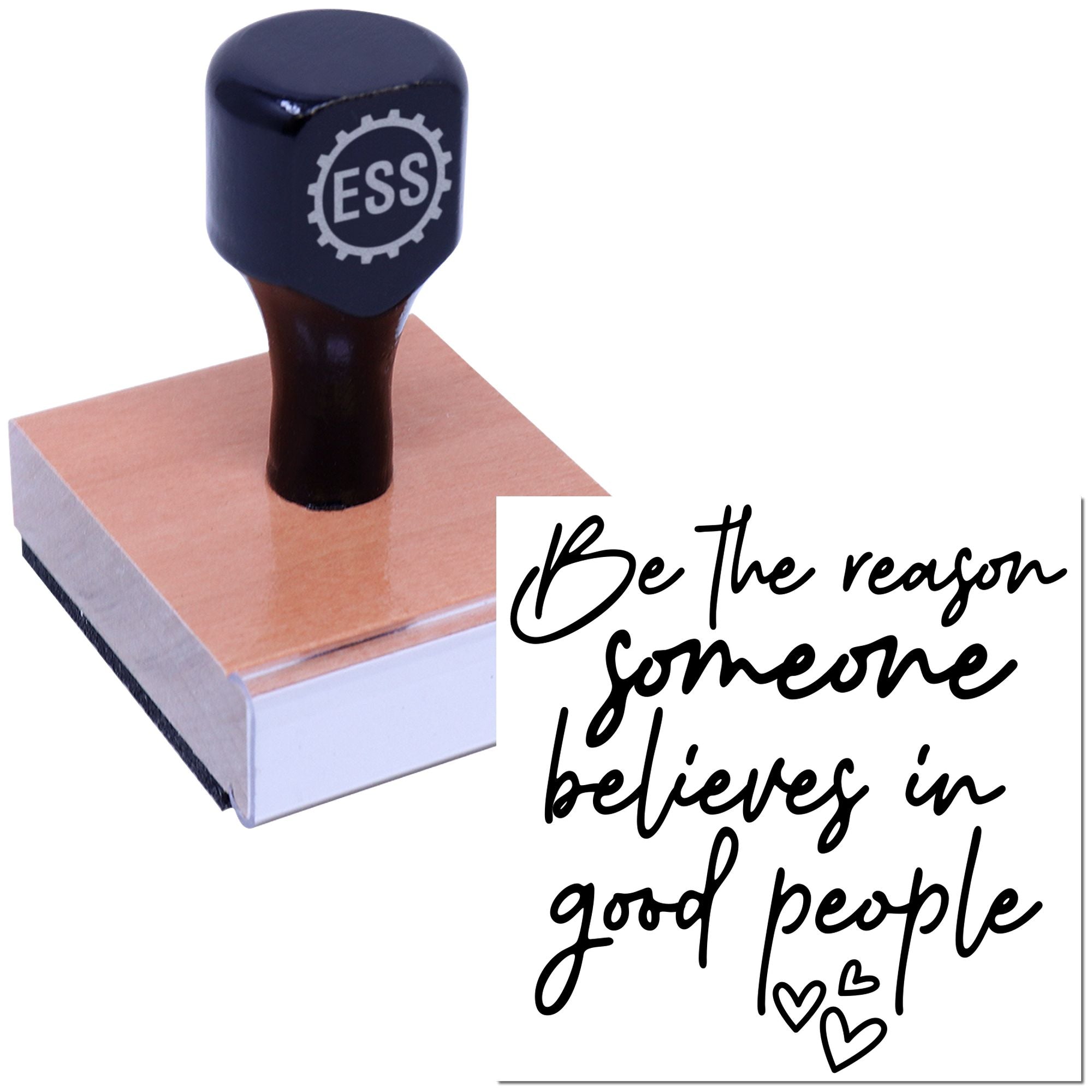 Black ESS rubber stamp on pink block base, with a seal reading Be the reason someone believes in good people.