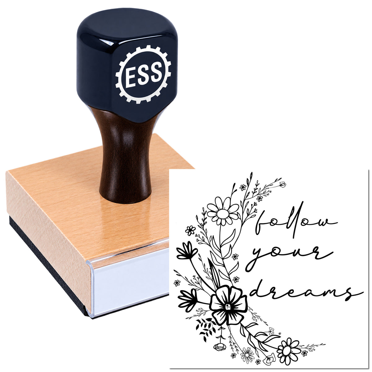 Black ESS stamp seal on a pink wooden block, with a black floral "follow your dreams" design.