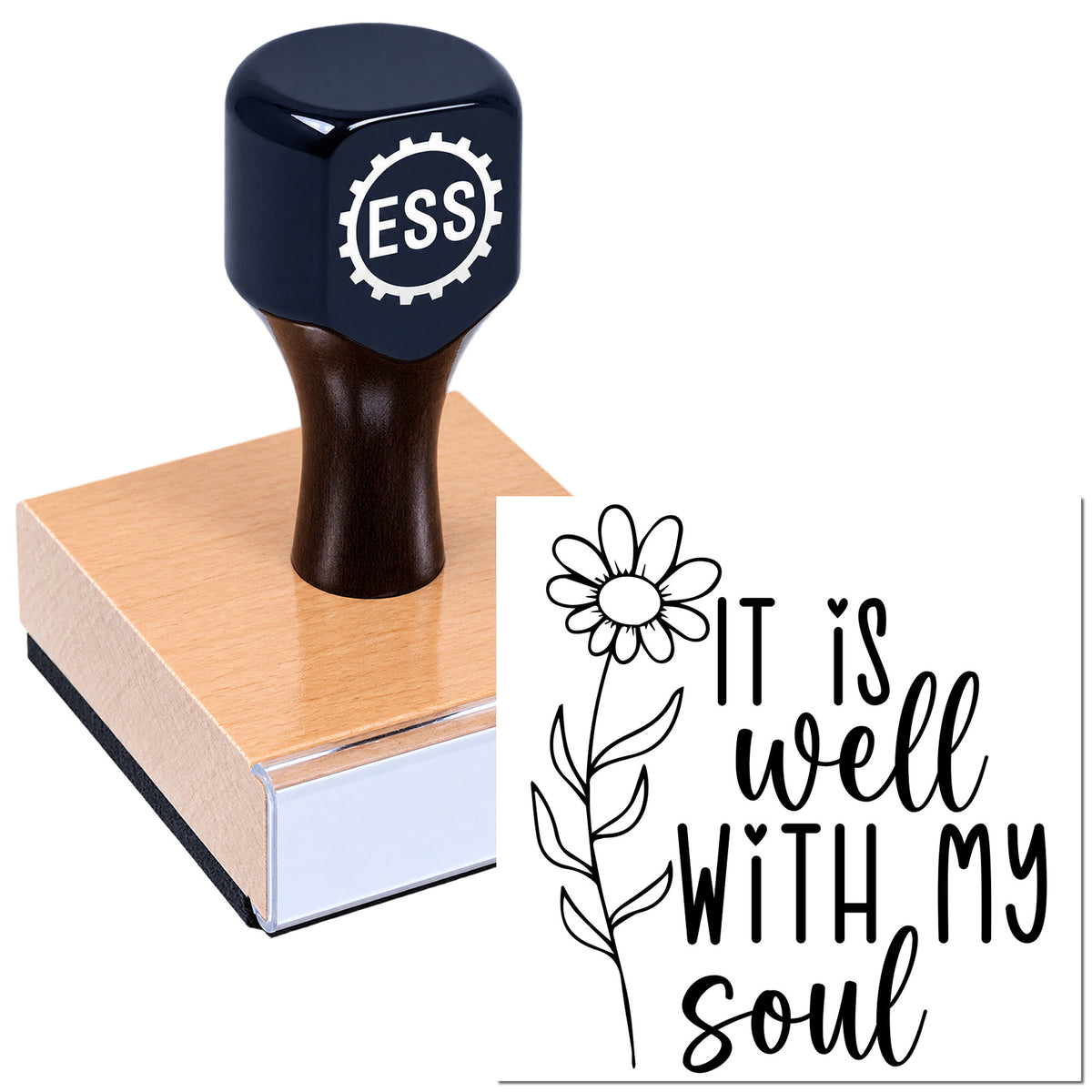 Dark blue custom rubber stamp on pink wooden seal block, featuring black floral "It is well with my soul" design.