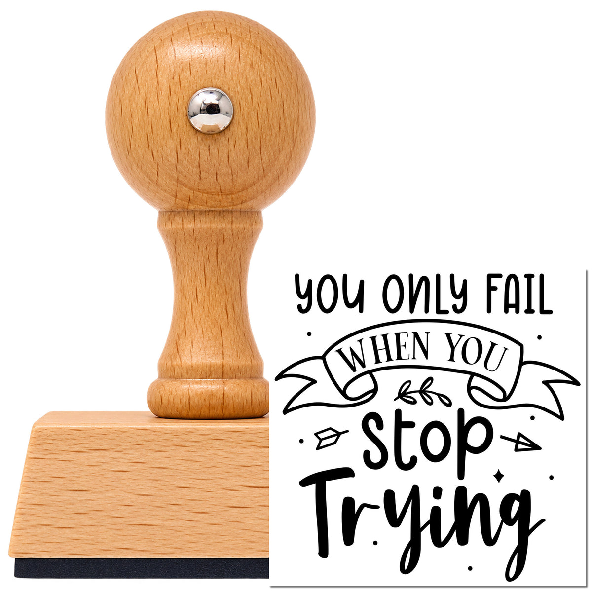 Vintage Pro beech wood stamp with a round knob handle, shown with its black You Only Fail When You Stop Trying Arrow imprint on white.