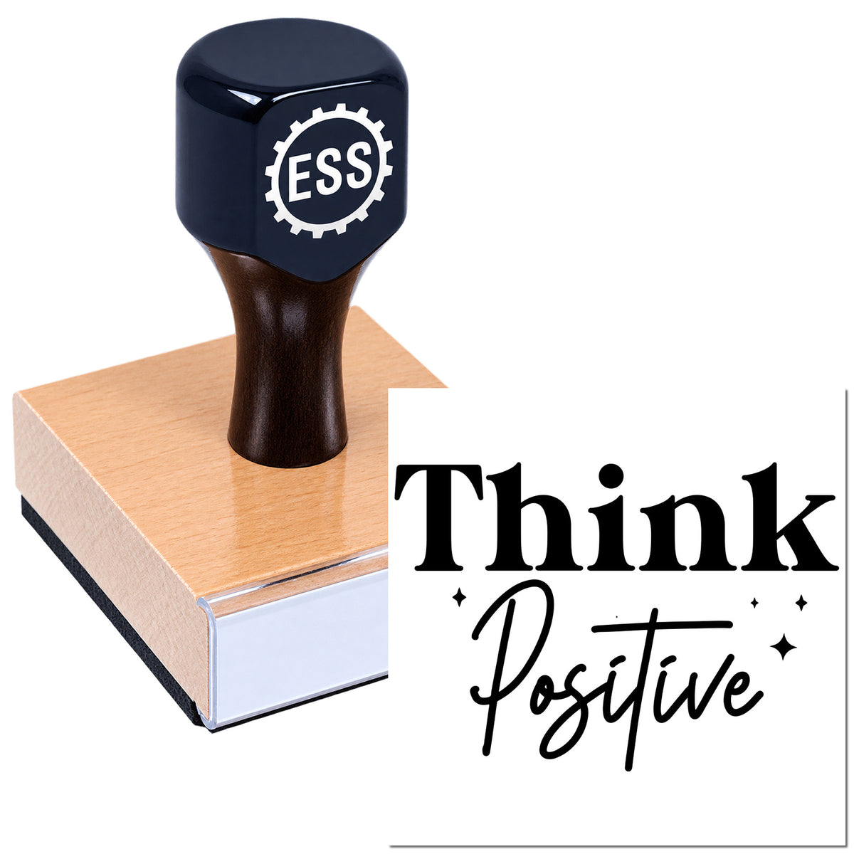Dark navy ESS rubber stamp on pink wooden seal block with black "Think Positive" text.