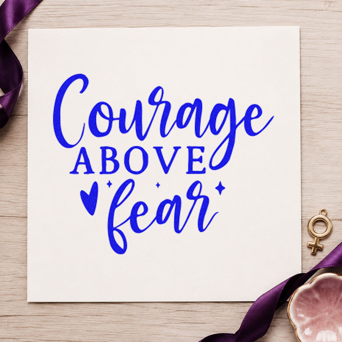 Courage Above Fear Heart craft stamp imprinted in blue ink on paper, a design suited to framed base room.