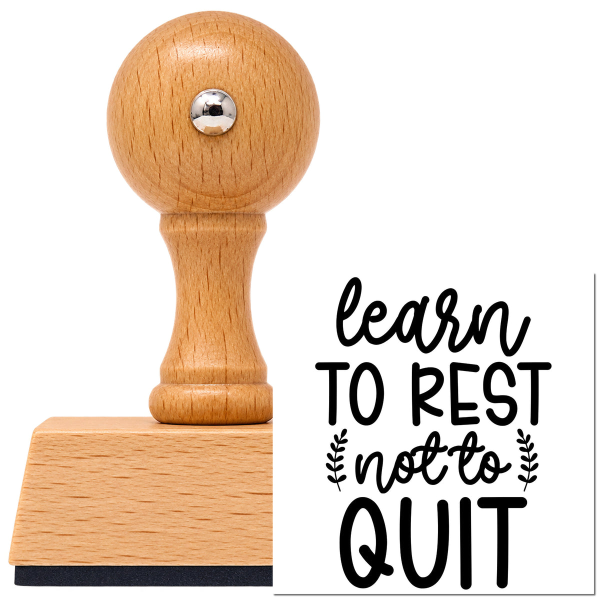 Vintage Pro beech wood stamp with a round knob handle, shown with its black Learn To Rest Not To Quit imprint on white.