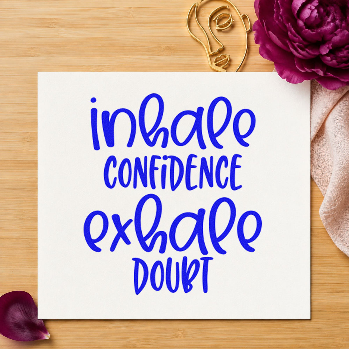 Inhale Confidence Exhale Doubt craft stamp in blue ink on cardstock, an easy option for deck towel printing.
