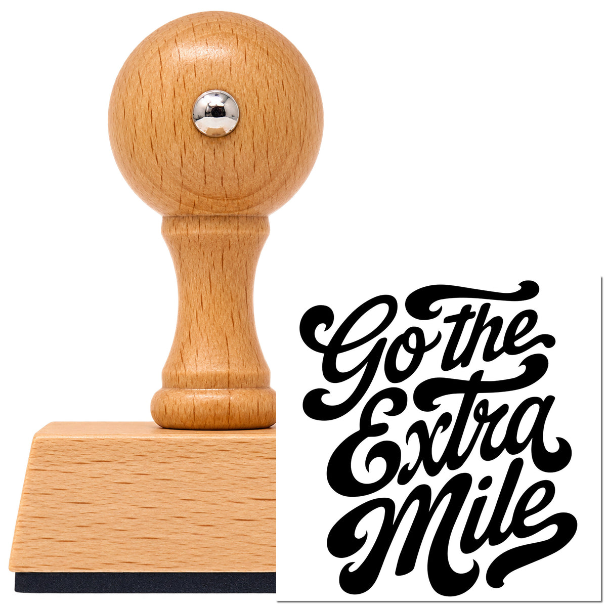 Vintage Pro beech wood stamp with a round knob handle, shown with its black Go The Extra Mile imprint on white.