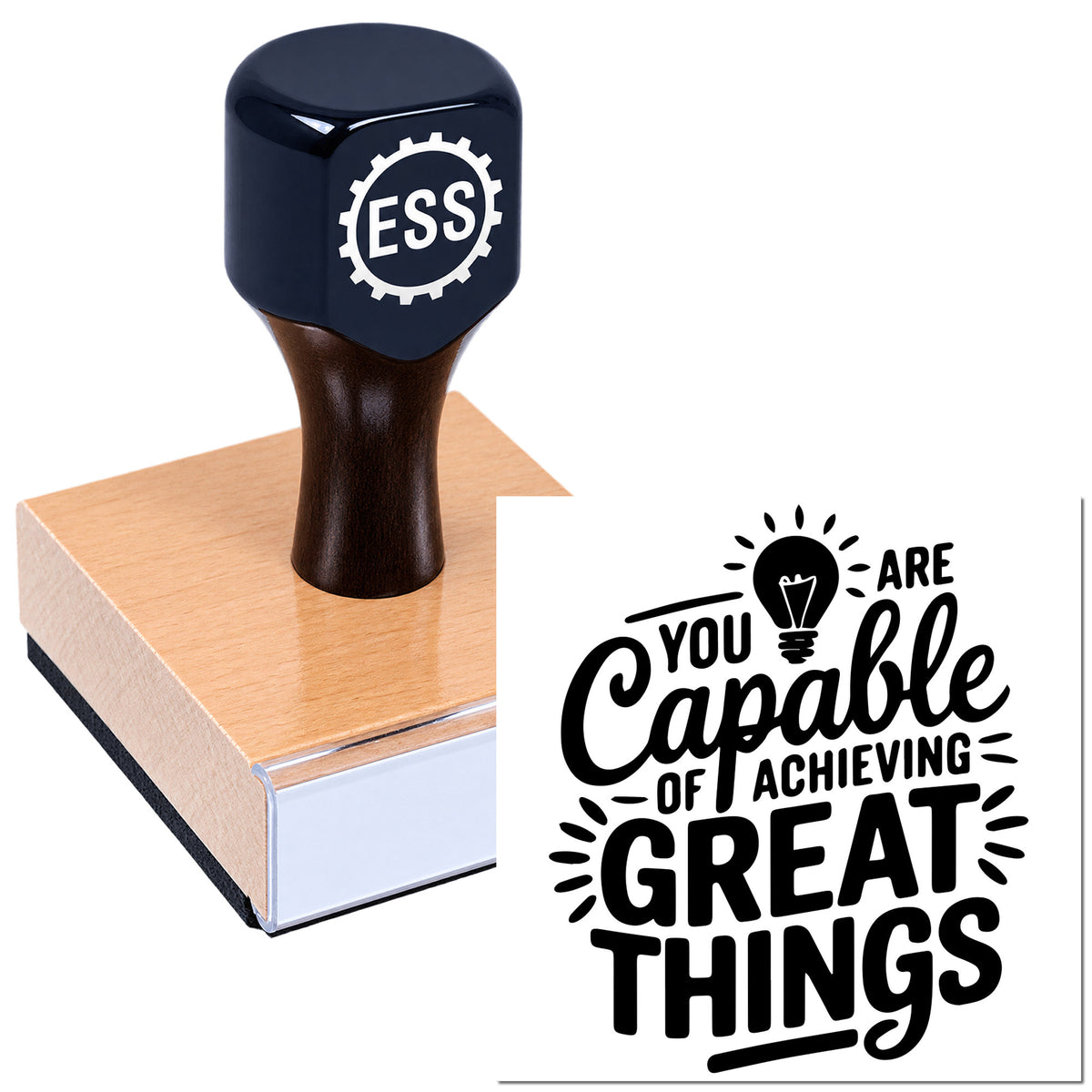 Black ESS stamp and seal on a wood block, with bold black motivational print: "You are capable of achieving great things."