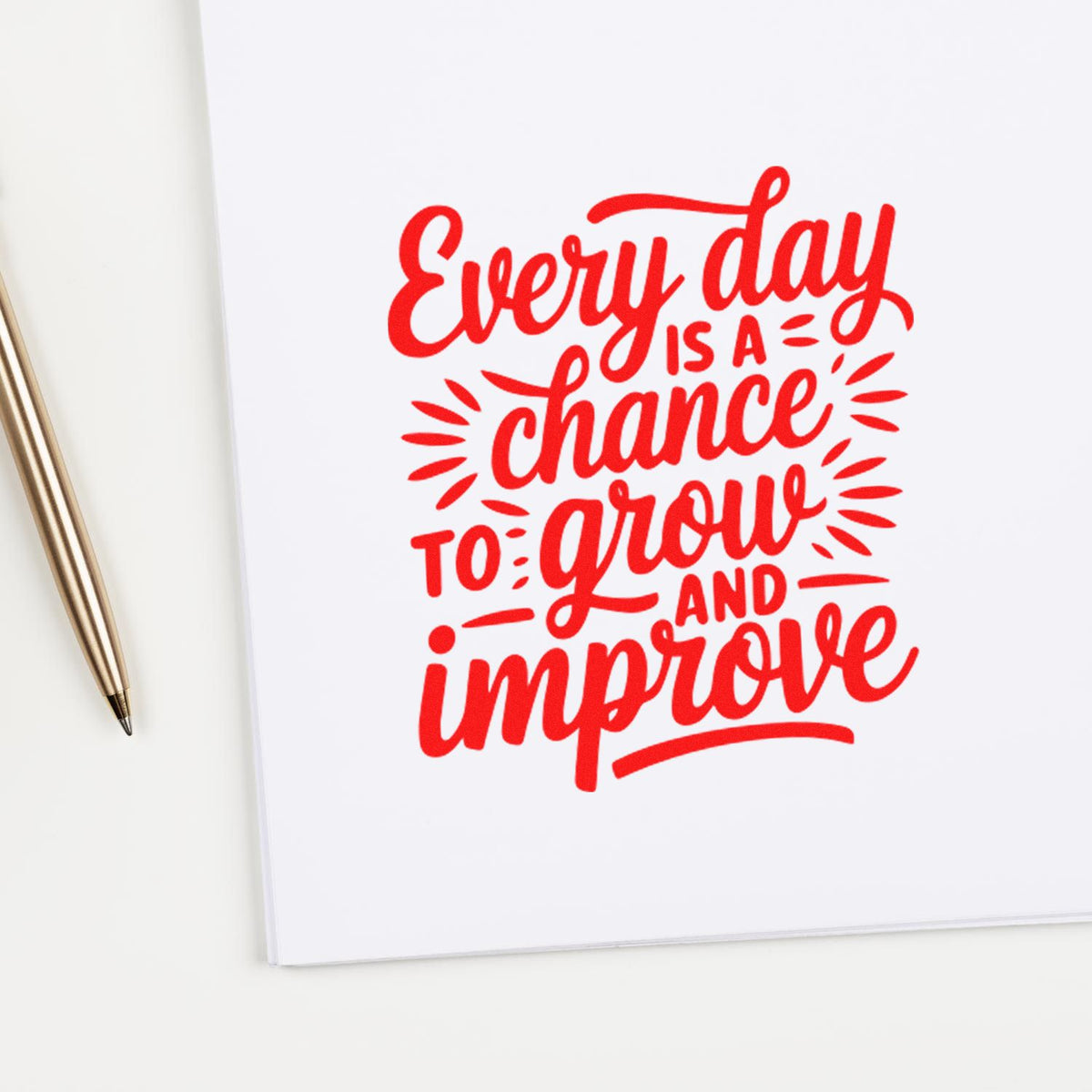 Red stamp-and-seal design on white paper reads Every day is a chance to grow and improve, beside a gold pen.