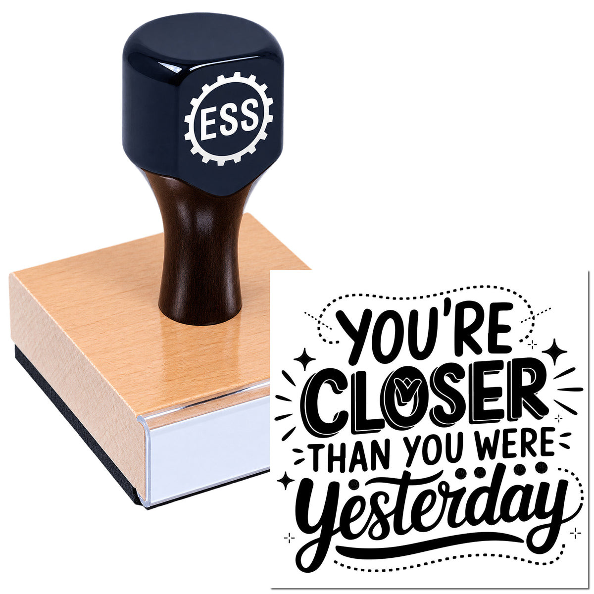 Black ESSI stamp on a copper-toned seal block with bold black "You're closer than you were yesterday" lettering.