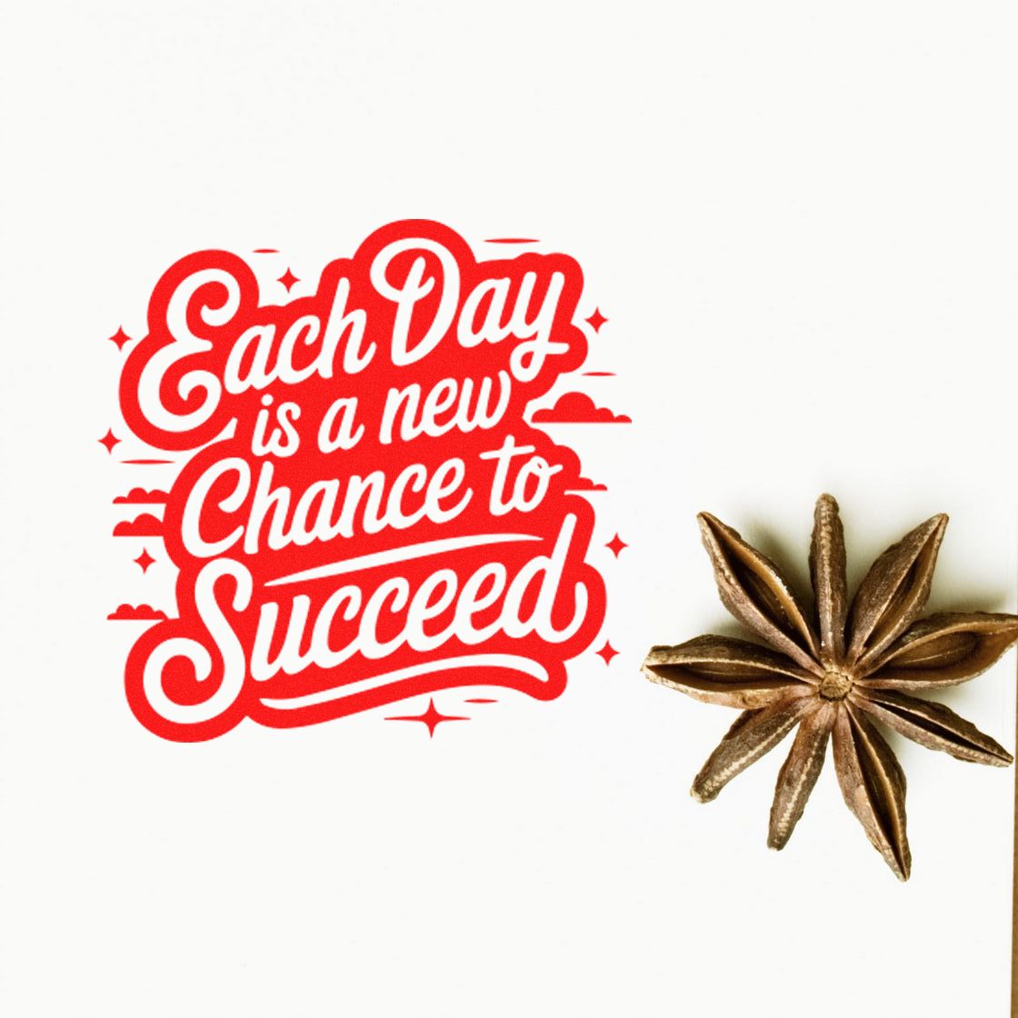 Red motivational stamp reading Each Day is a new Chance to Succeed with a brown star anise seal.