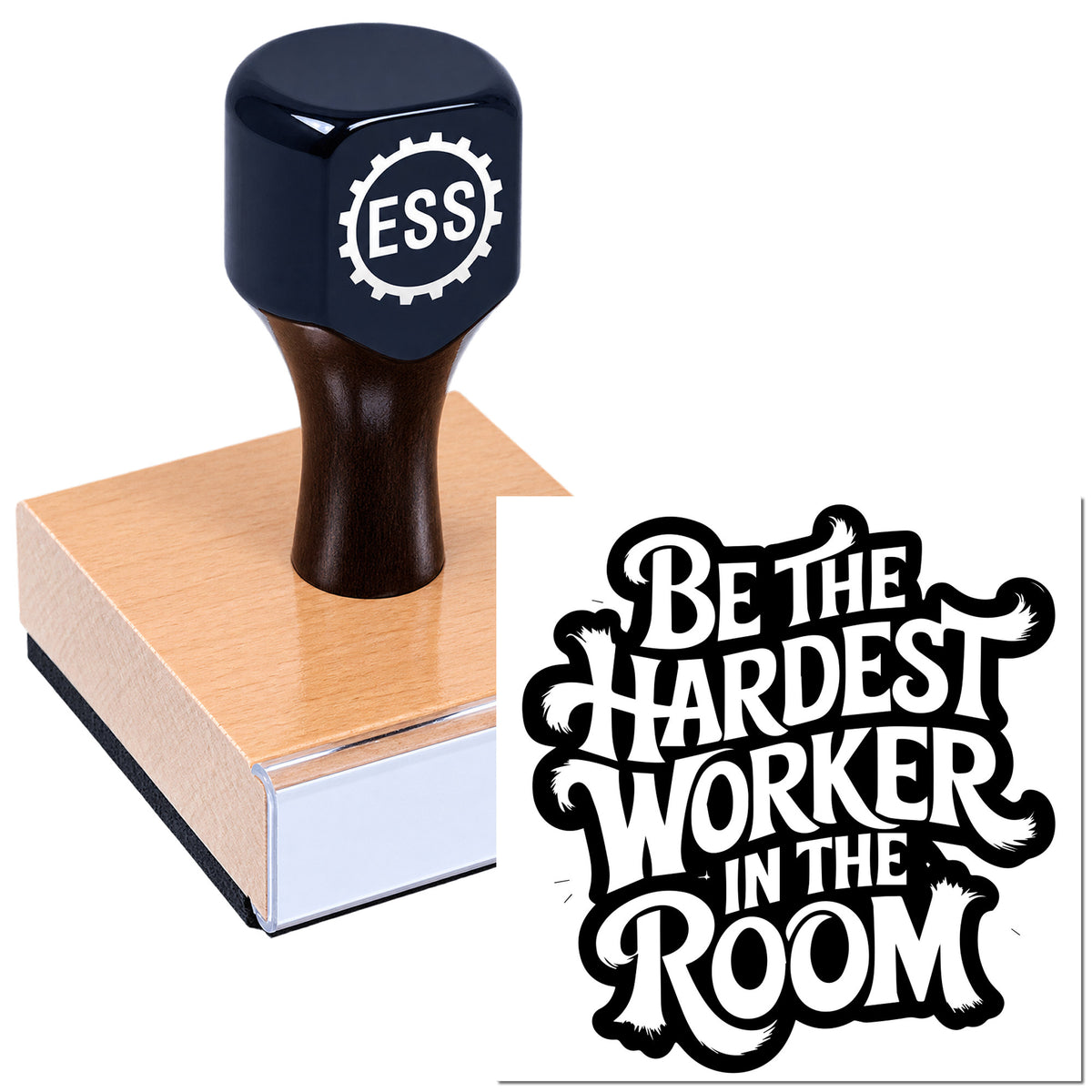 Navy rubber stamp and wooden seal pressing a tan block, with bold black-and-white "Be the Hardest Worker in the Room" imprint.