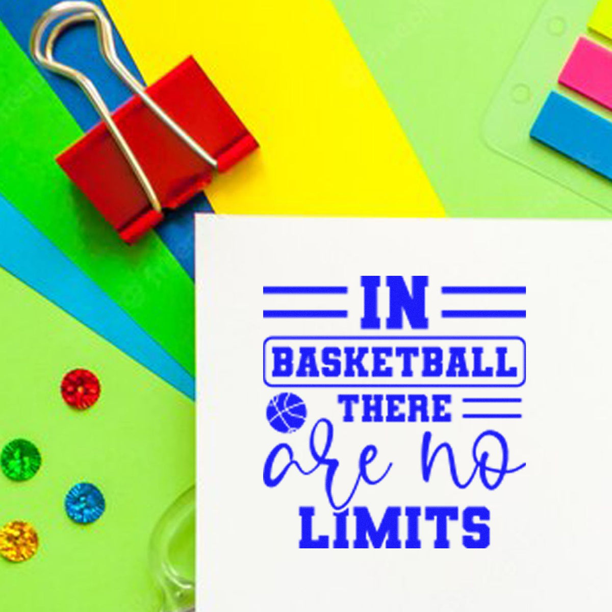 Blue stamp and seal reading In basketball there are no limits on white card, with colorful paper clips and sticky notes.