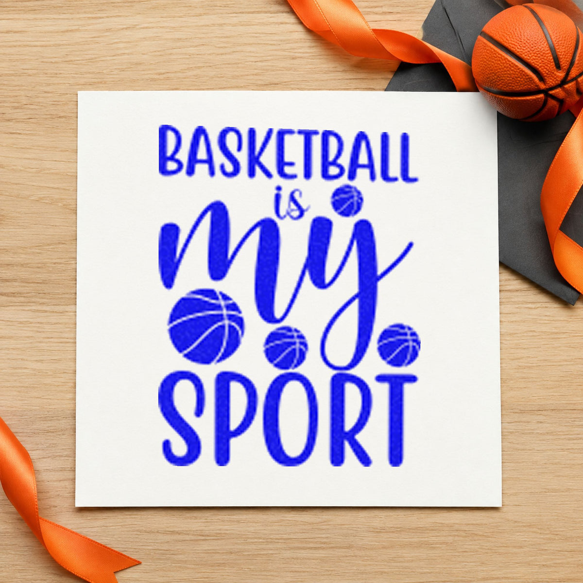 Basketball Is My Sport craft stamp in blue ink on cardstock, an easy option for practice tee printing.