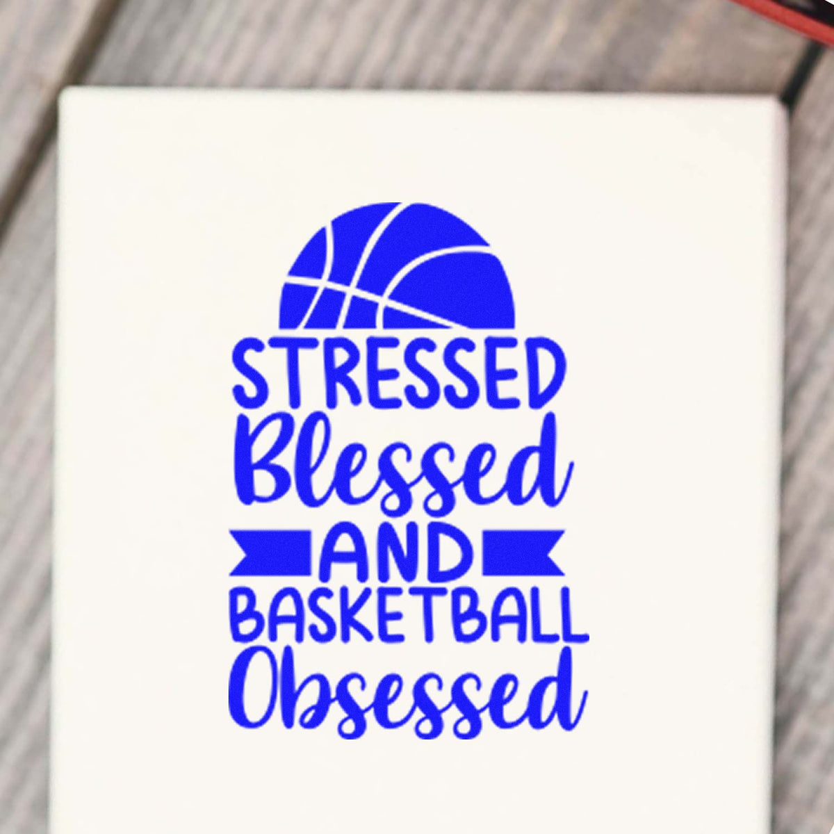 Blue basketball-themed stamp and seal reading Stressed Blessed and Basketball Obsessed on a white background.