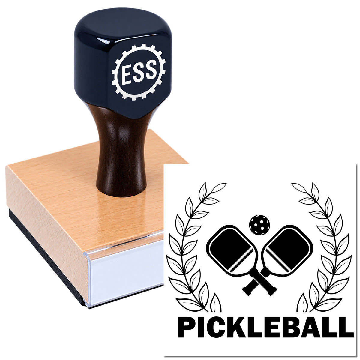 Black ESS stamp and seal on wooden block, featuring a pickleball emblem with crossed paddles and laurel branches.