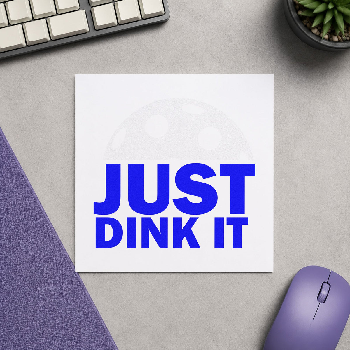 Just Dink It Ball craft stamp in blue ink on cardstock, an easy option for court towel printing.