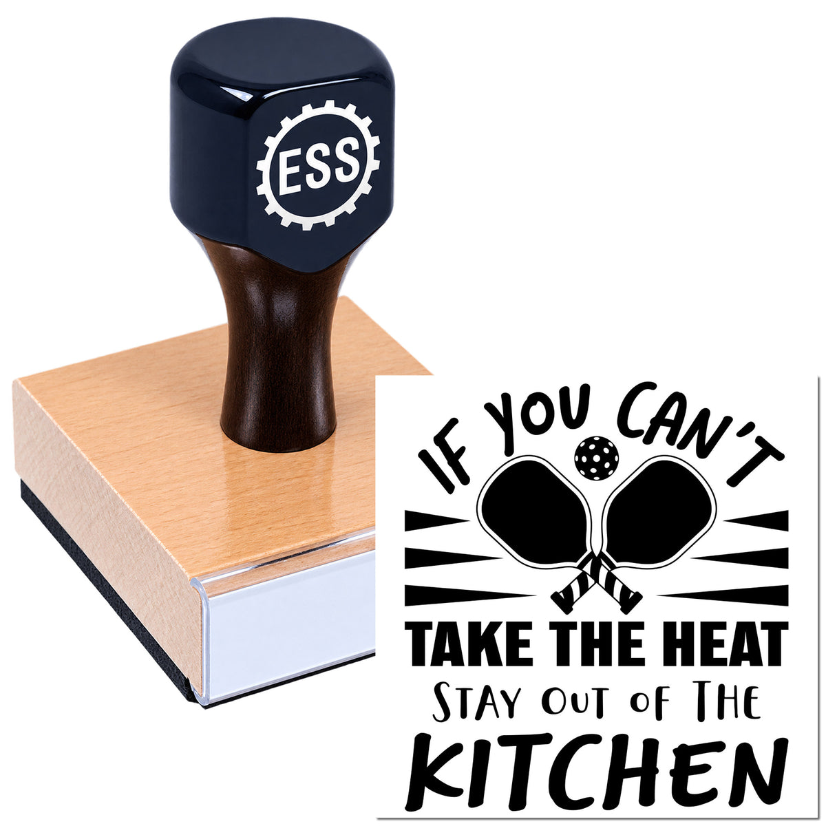 Black ESS rubber stamp on wood block with "If you can't take the heat stay out of the kitchen" seal in bold black.