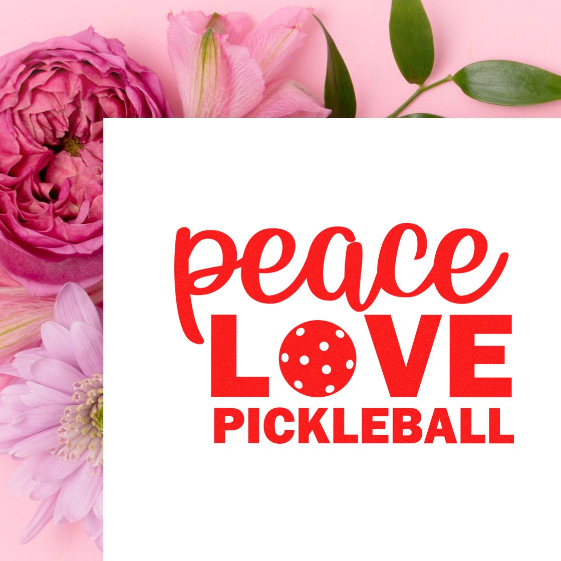 Red peace love pickleball stamp and seal design on white card, framed by pink flowers and green leaves.