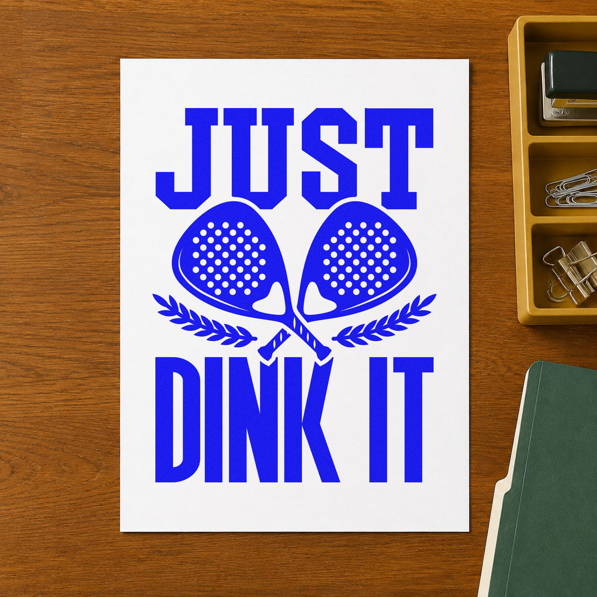 Just Dink It Laurels craft stamp in blue ink on cardstock, an easy option for staff tee printing.