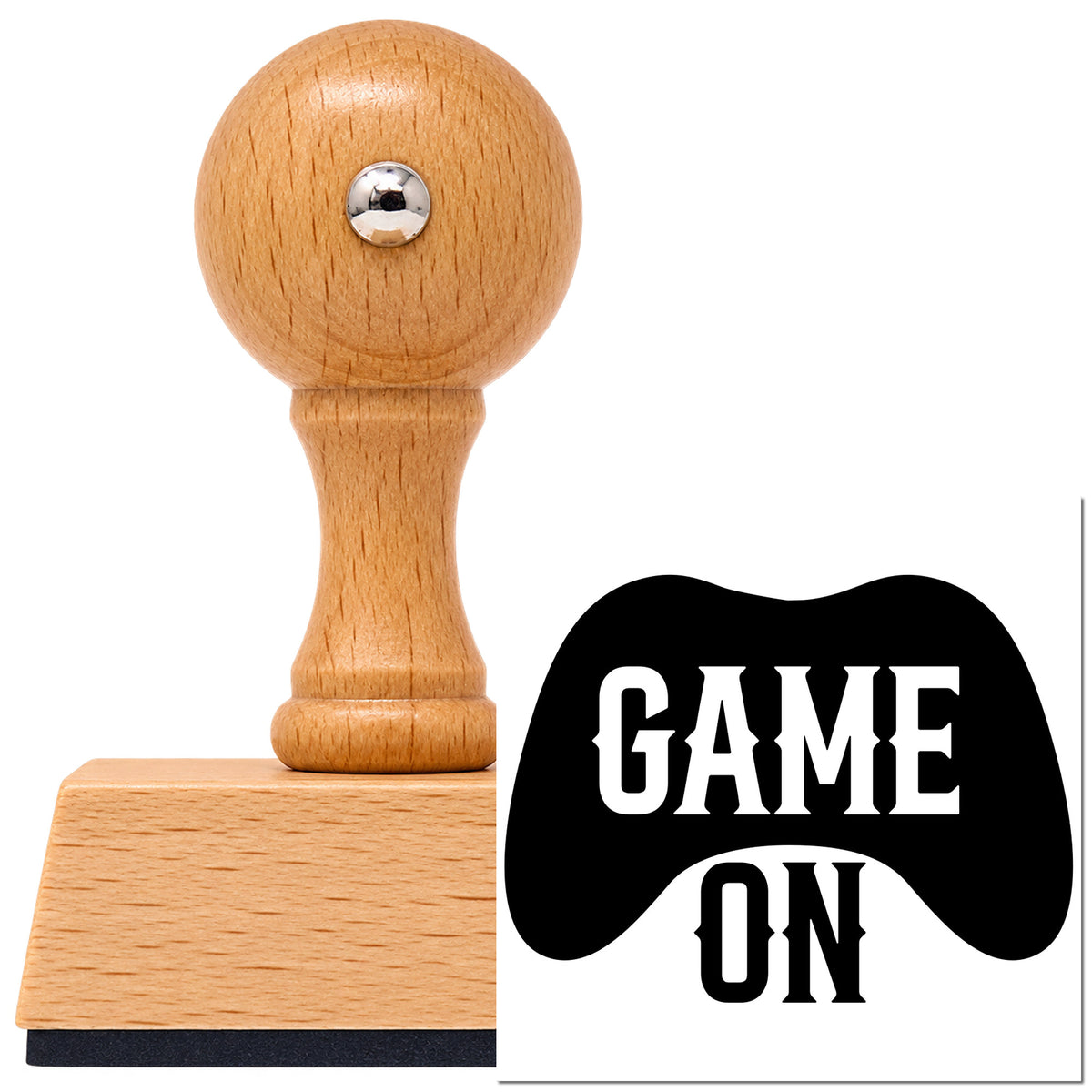 Vintage Pro beech wood stamp with a round knob handle, shown with its black Game On Controller Silhouette imprint on white.