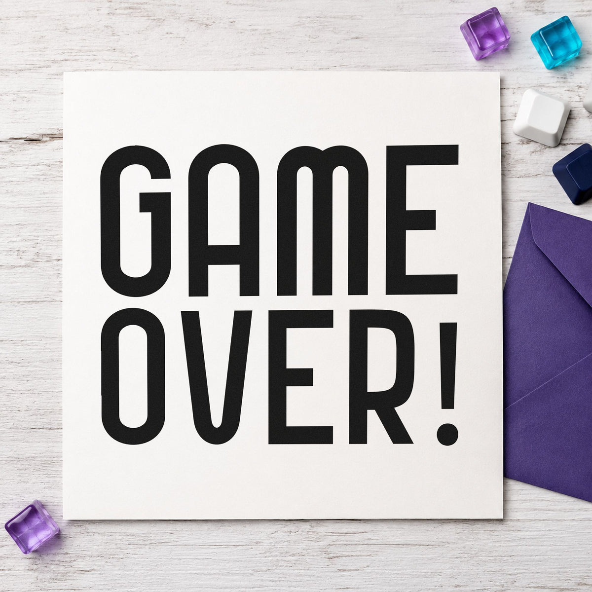 Game Over Tall Lettering craft stamp imprint in black ink on a handmade project, one idea being token bag gift tags.