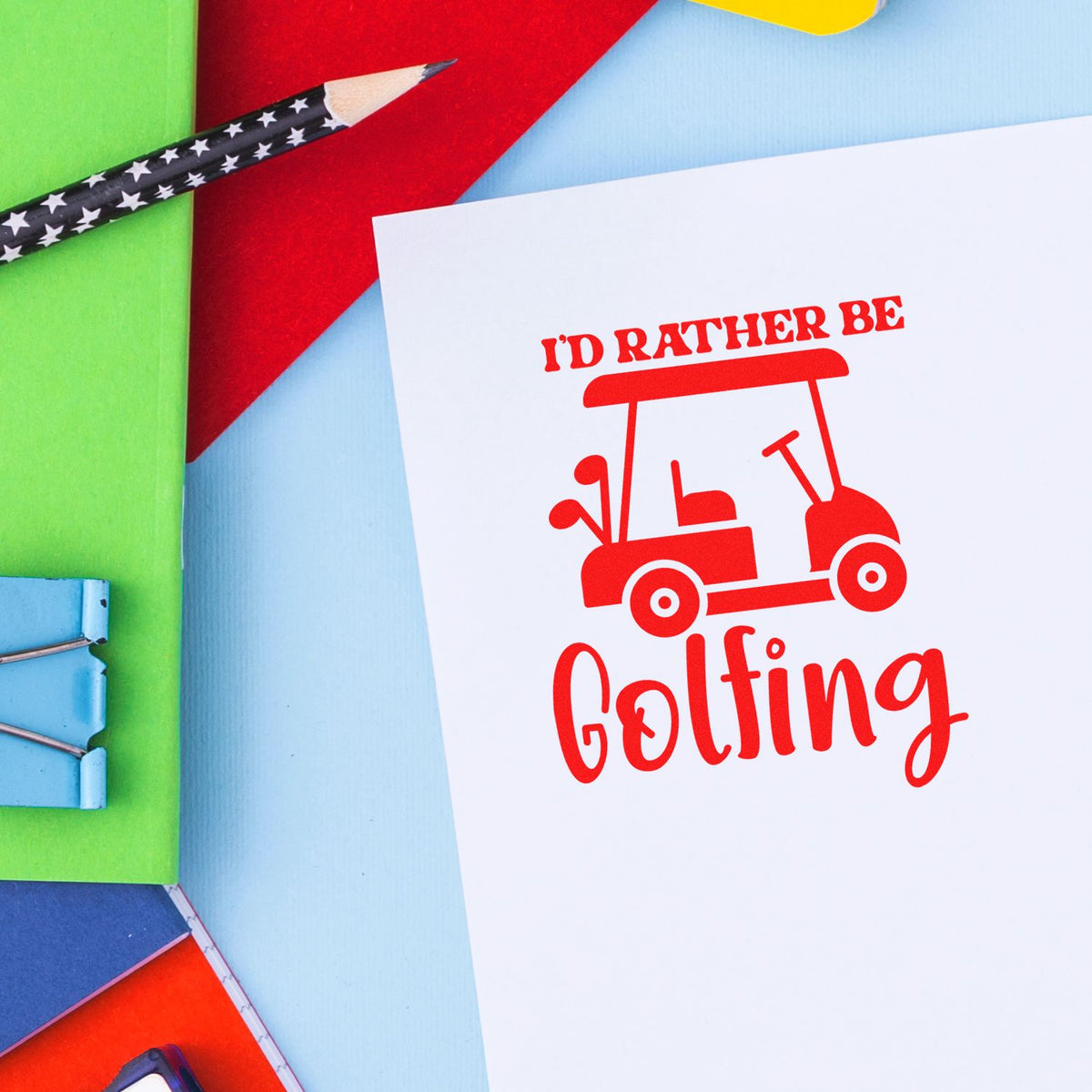 Red golfing stamp and seal design on white card, with golf cart icon, pencil, and colorful paper background.