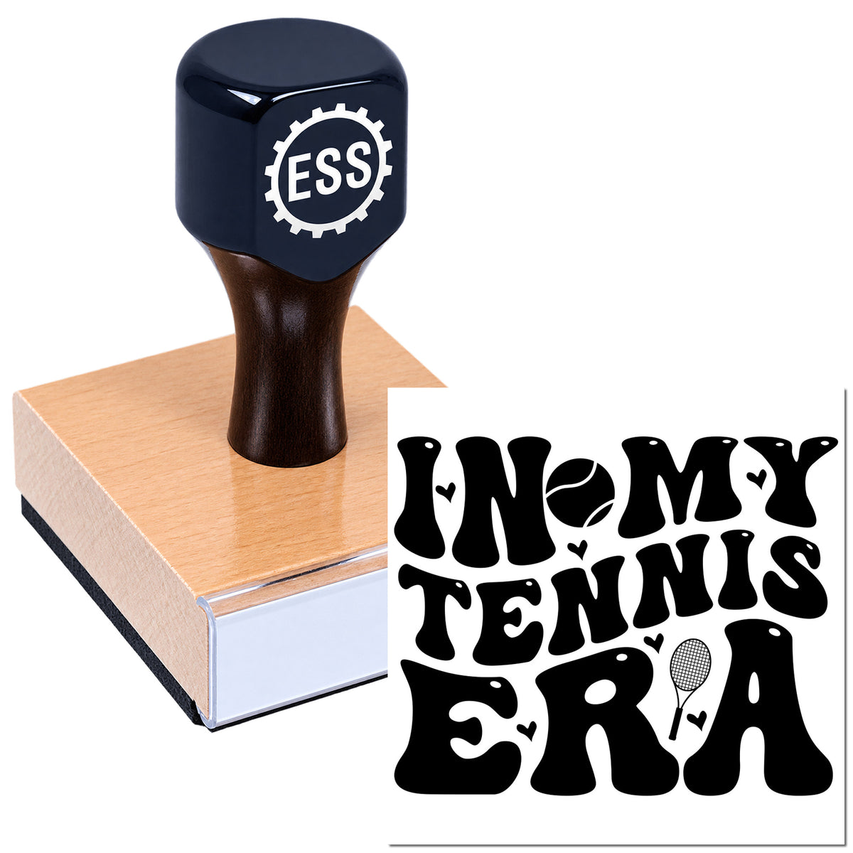 Dark navy ESS stamp with wooden handle and pink base, featuring a custom tennis-era seal design.