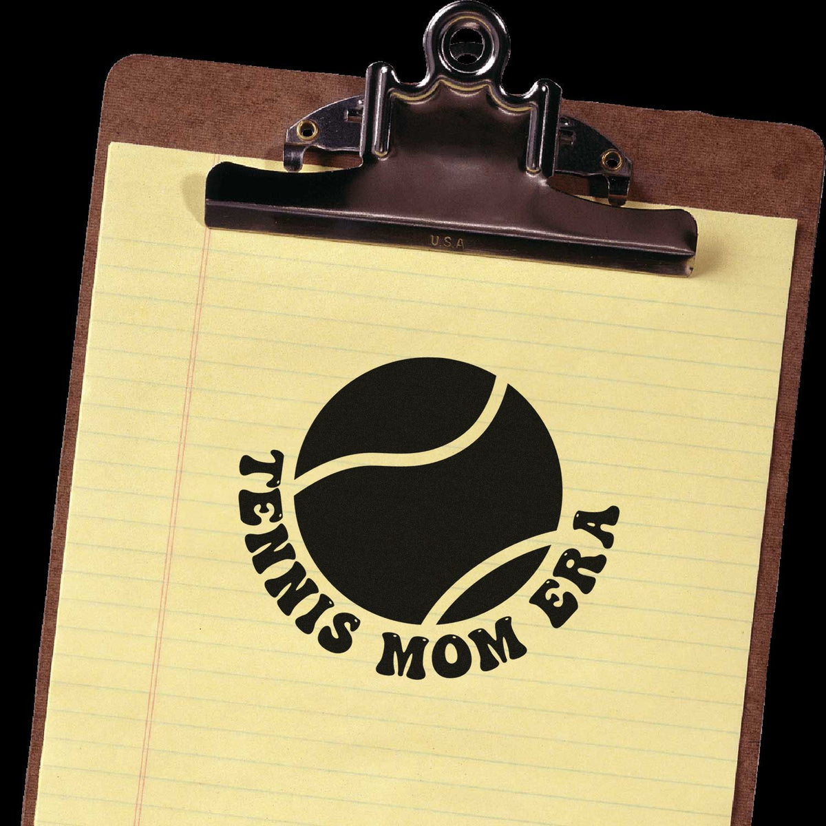 Black custom stamp and seal with tennis ball logo on yellow legal pad, clipped to a brown clipboard