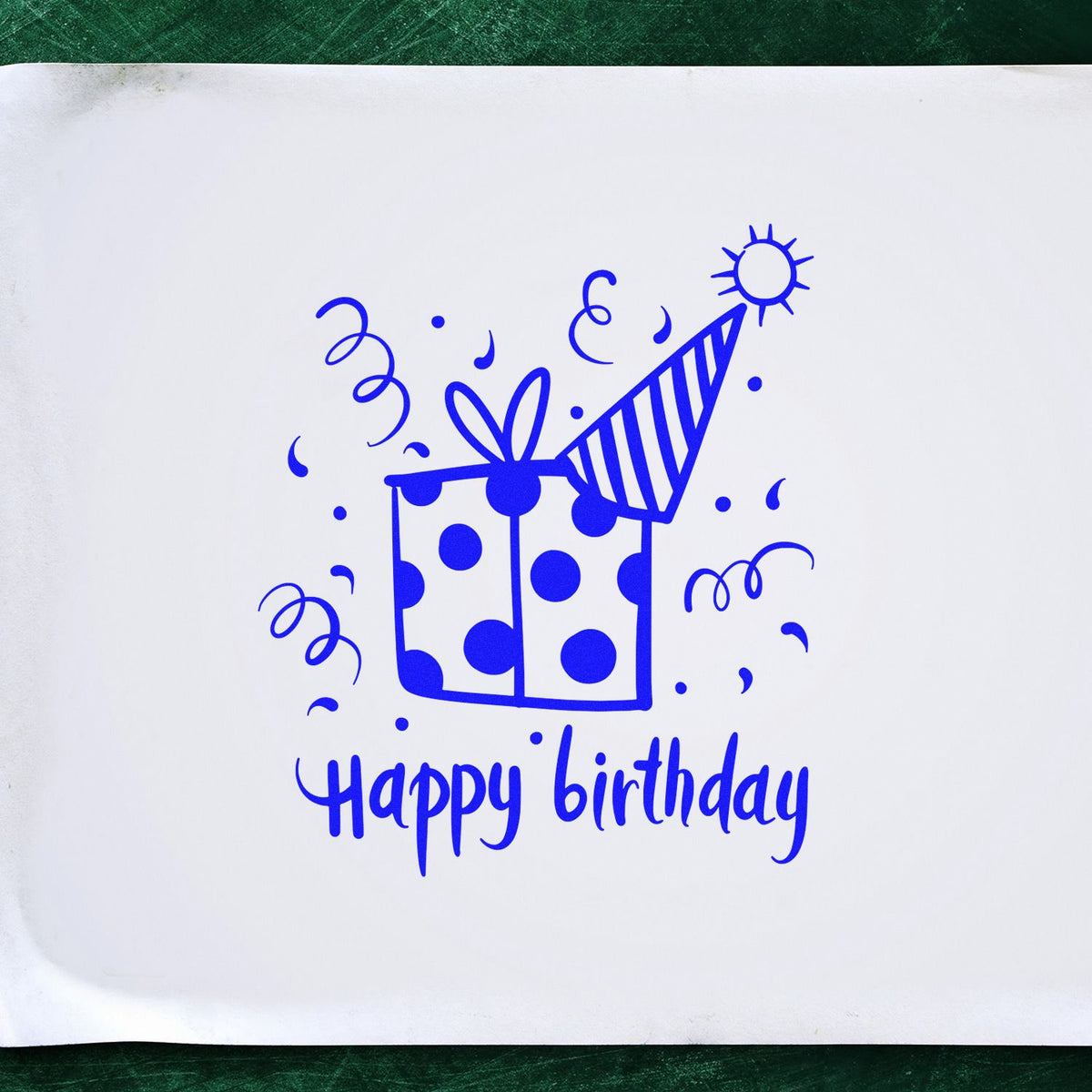 Blue birthday stamp seal with gift box, party hat, confetti, and Happy birthday text on white paper.