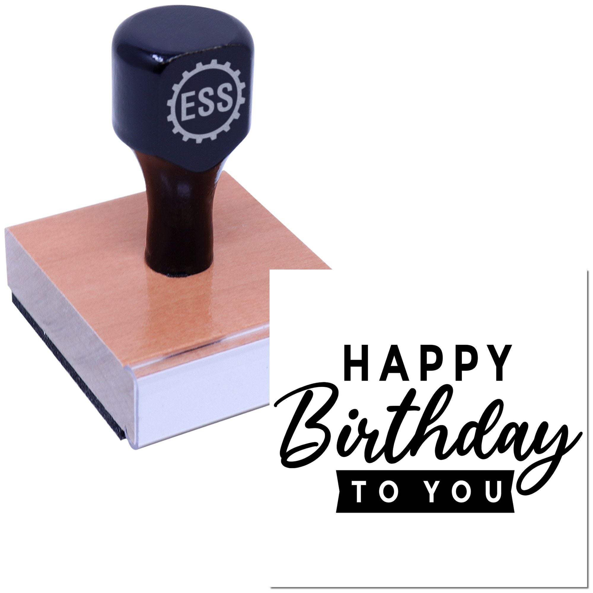 Black ESS rubber stamp and seal on wooden base with pink face, featuring a Happy Birthday to You design.