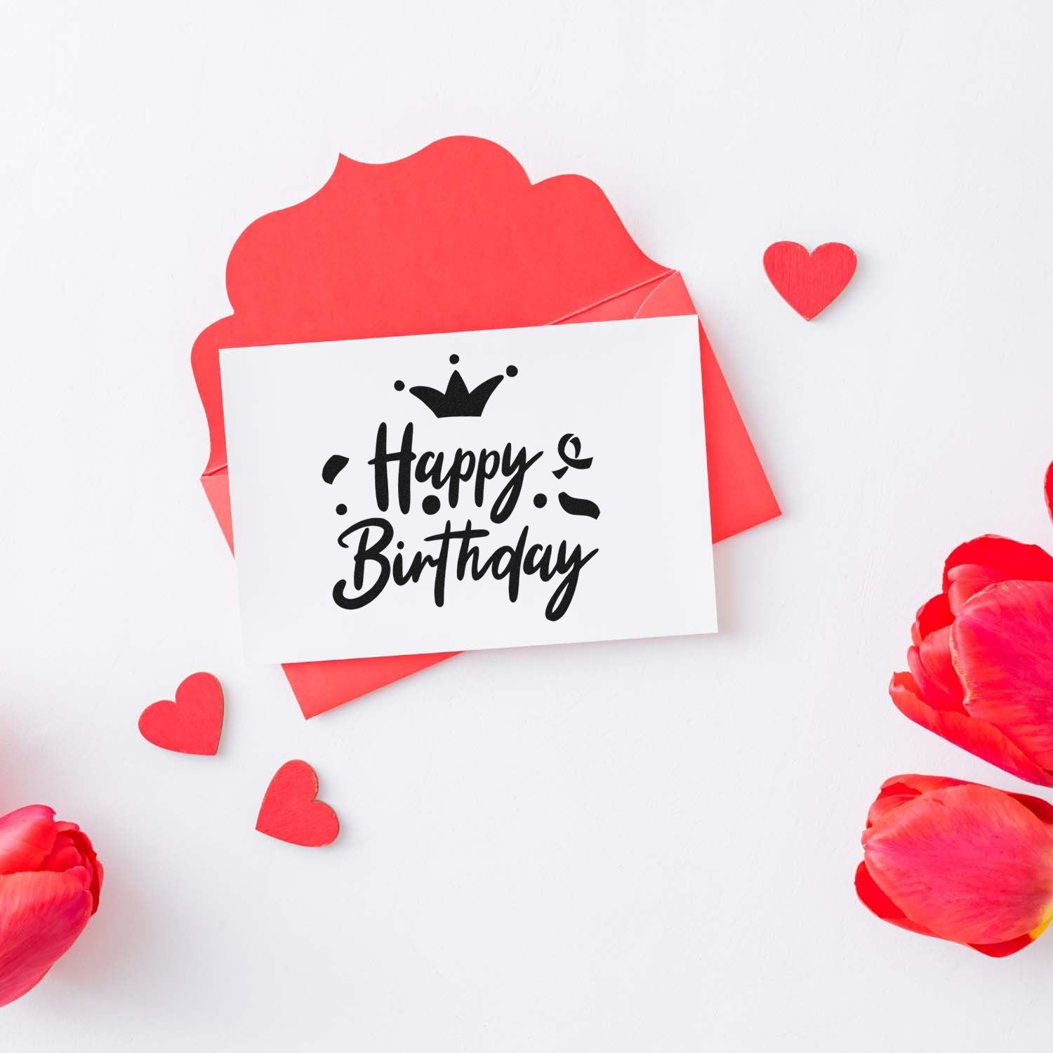 Black Happy Birthday stamp on white card over red wax seal, with red hearts and petals on a white background.