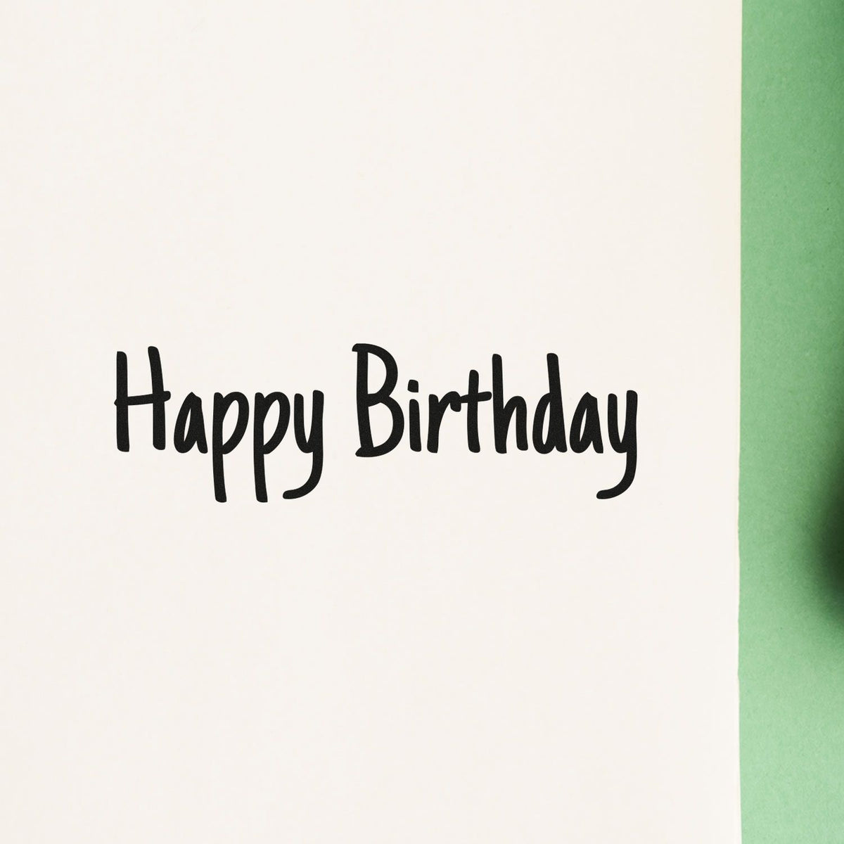 Black Happy Birthday stamp and seal on white card with green edge