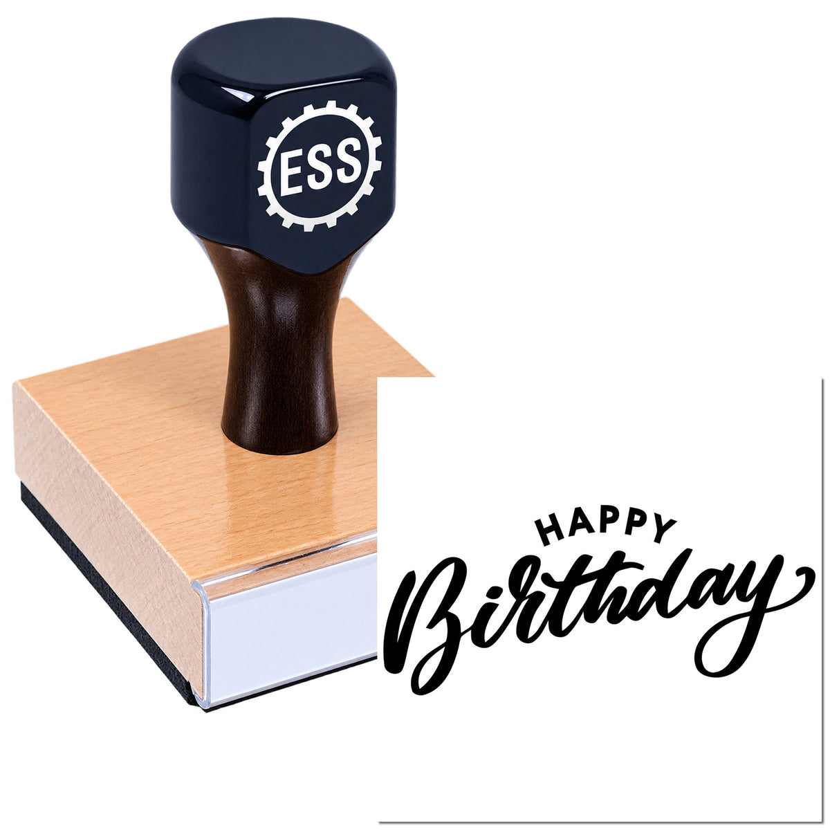 Black ESS rubber stamp with wooden block beside a "Happy Birthday" seal on white background