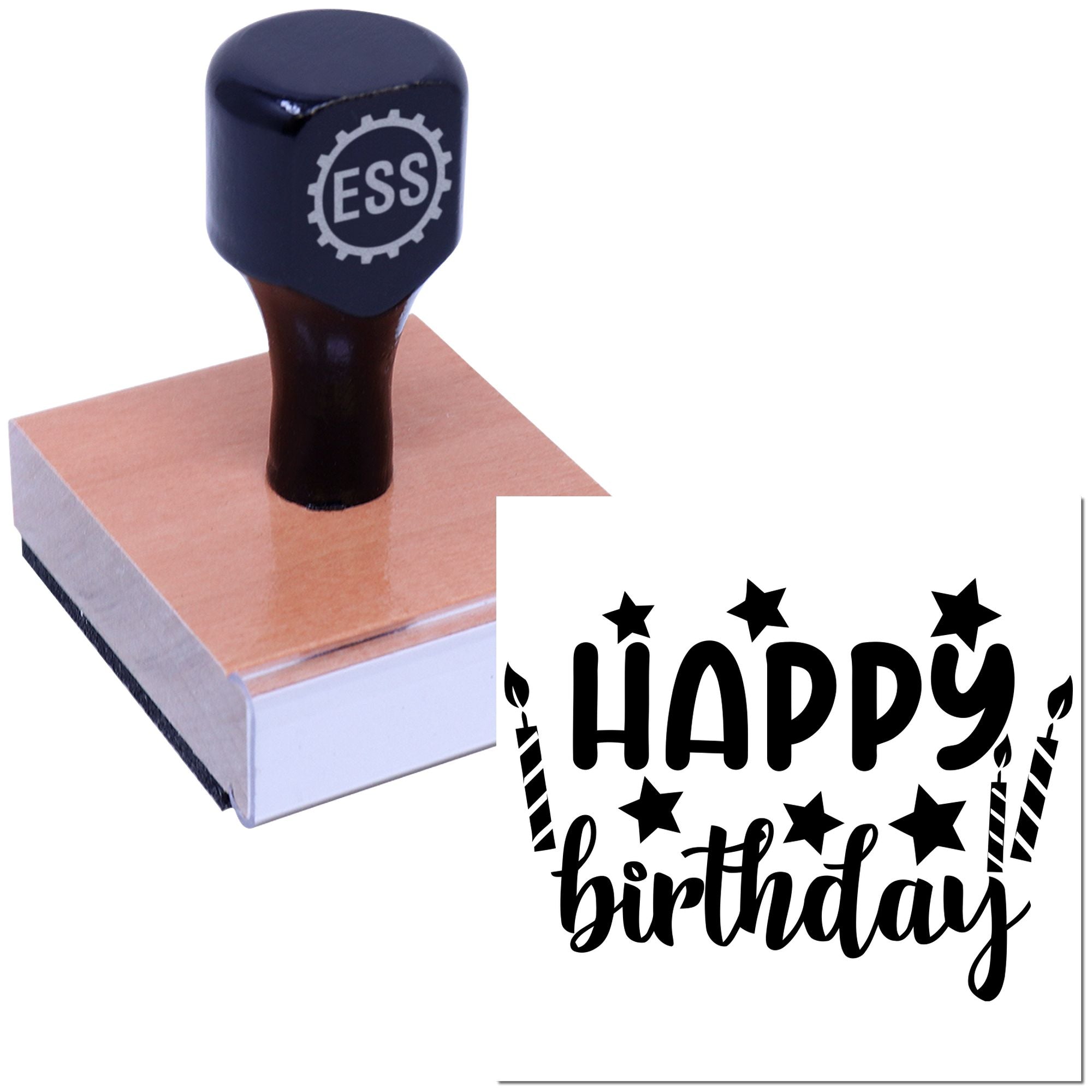 Dark navy ESS rubber stamp on a wooden block, with black Happy Birthday seal impression, stars, and candles.