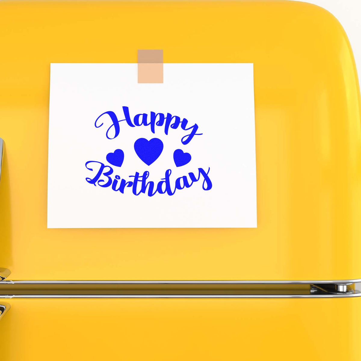 Blue Happy Birthday stamp with heart seals on a white card, mounted on a bright yellow product.