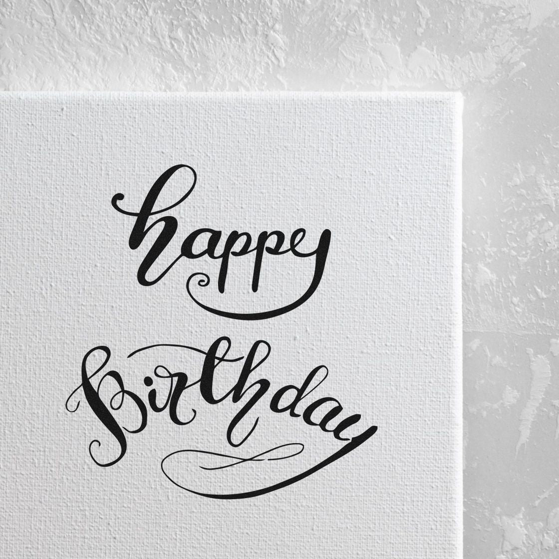 Black Happy Birthday stamp and seal design with decorative swirls on white textured canvas.