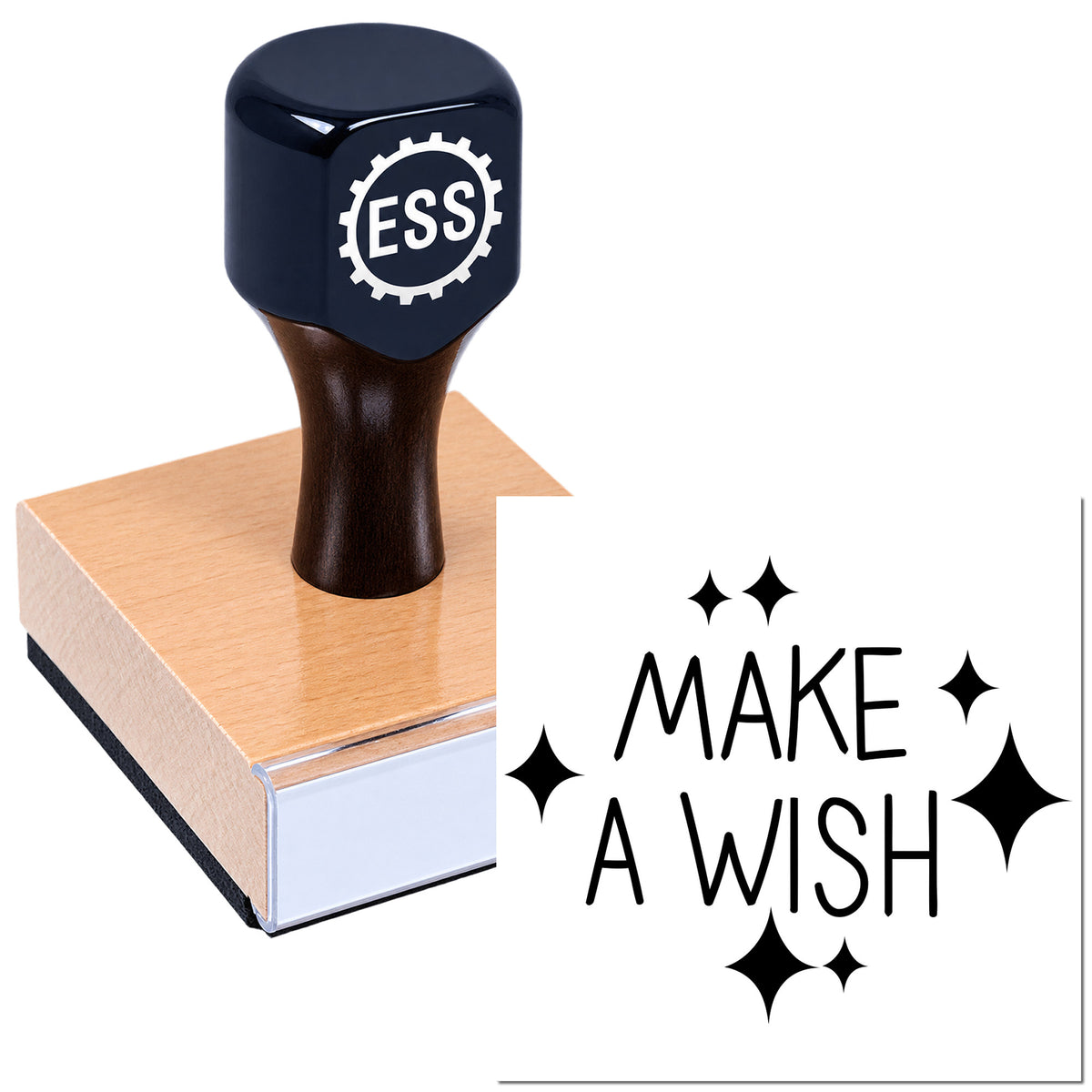 Black ESS rubber stamp on a wooden seal block, with pink base and "MAKE A WISH" text with sparkle icons.