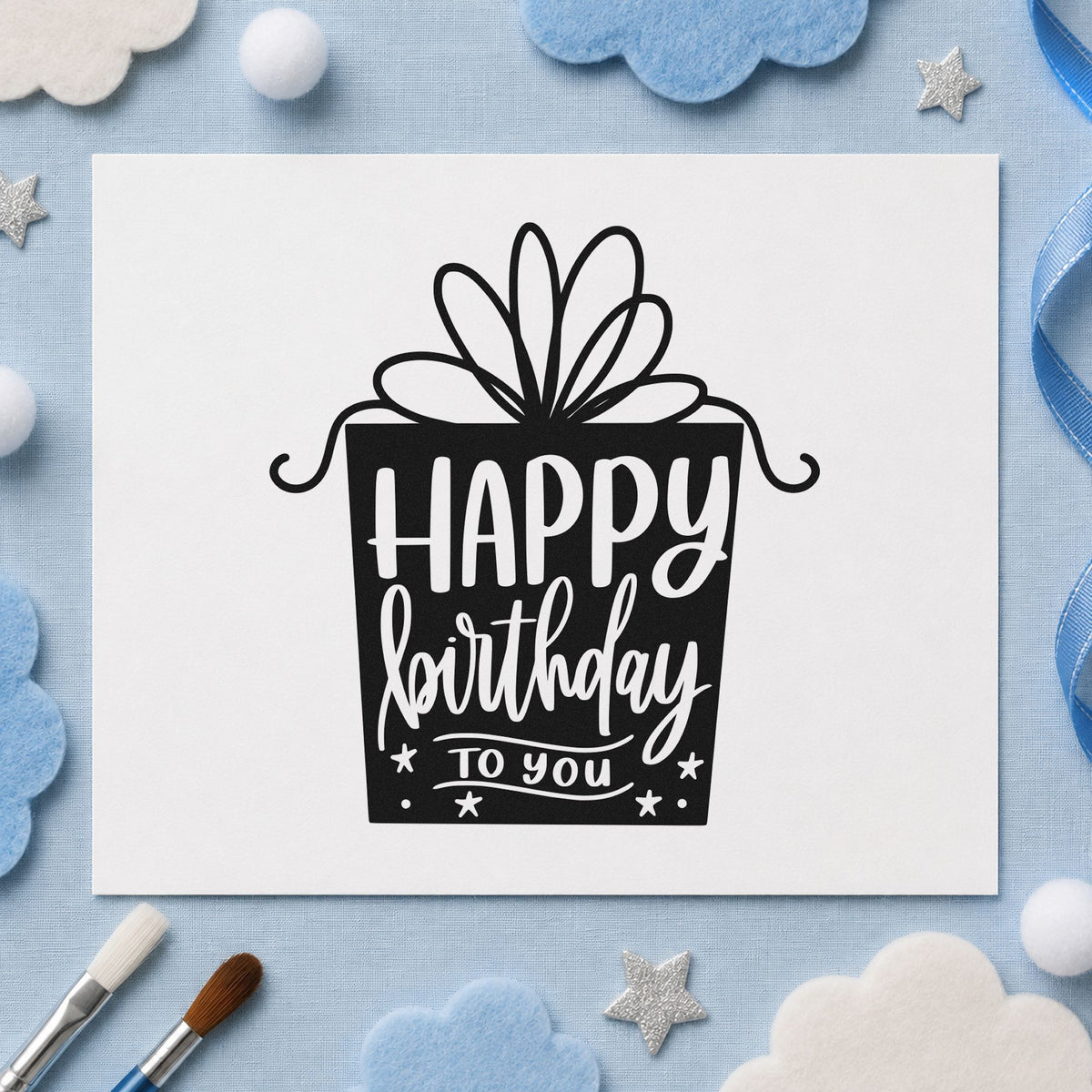 Birthday Gift Shaped Lettering craft stamp imprint in black ink on a handmade project, one idea being wrapped item tags.
