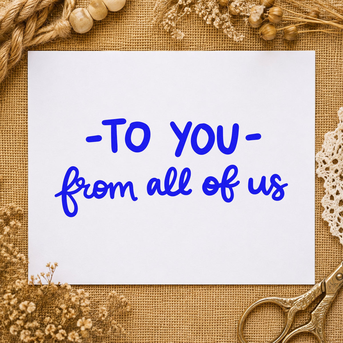 To You From All of Us craft stamp in blue ink on cardstock, an easy option for bunting panel printing.