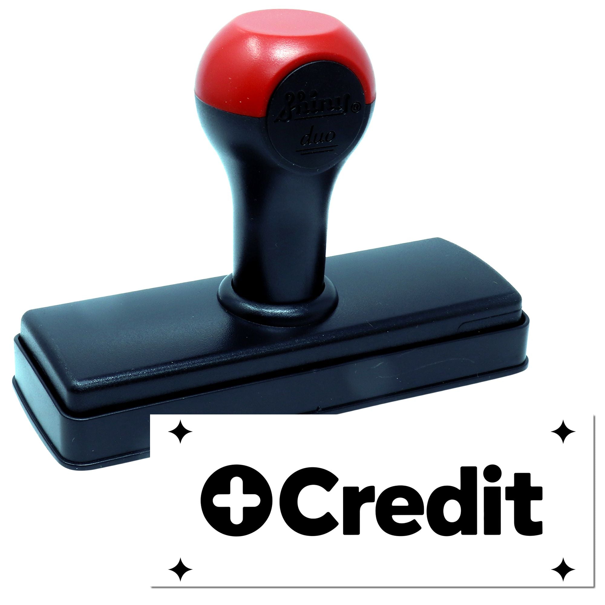 Red and black self-inking credit stamp and seal with rectangular base on white background.
