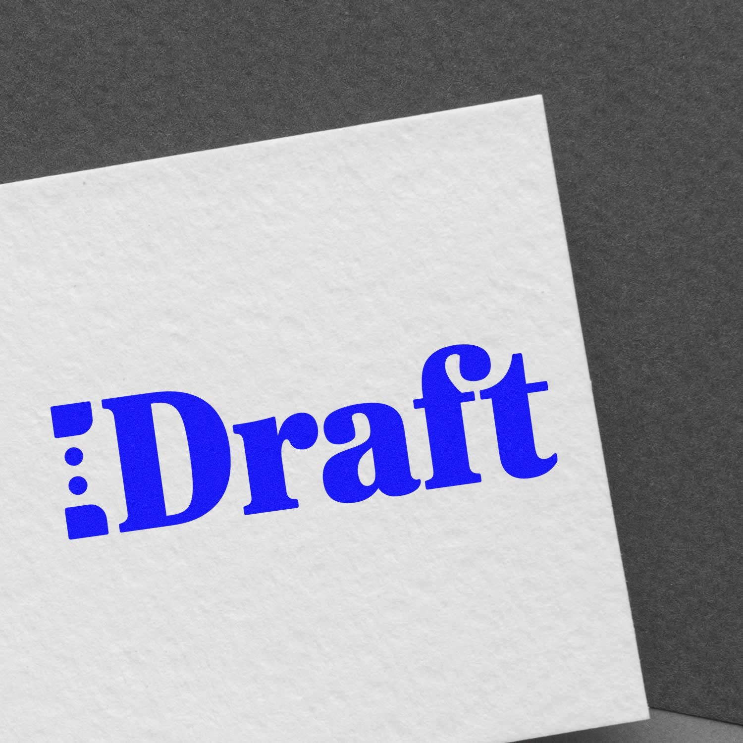 Blue Draft stamp-and-seal mark on white paper against a dark gray background.