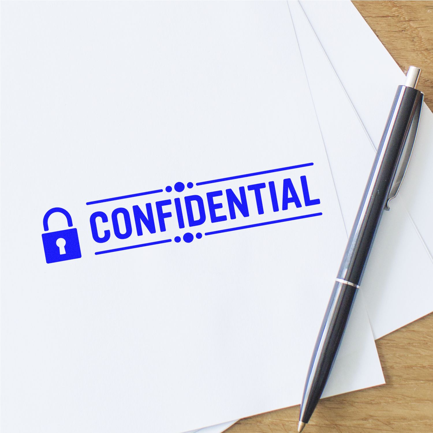Blue confidential stamp with padlock seal on white paper, beside a black pen on a wooden desk
