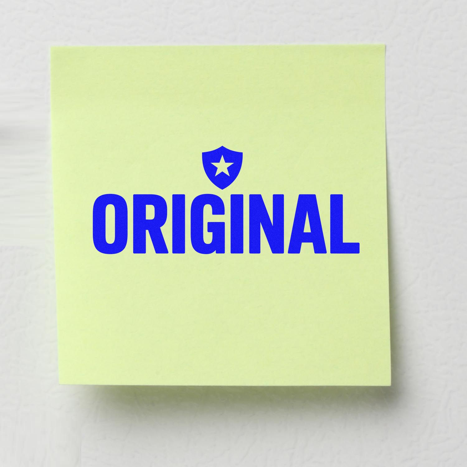 Pale yellow-green sticky note with blue ORIGINAL stamp seal and shield star logo