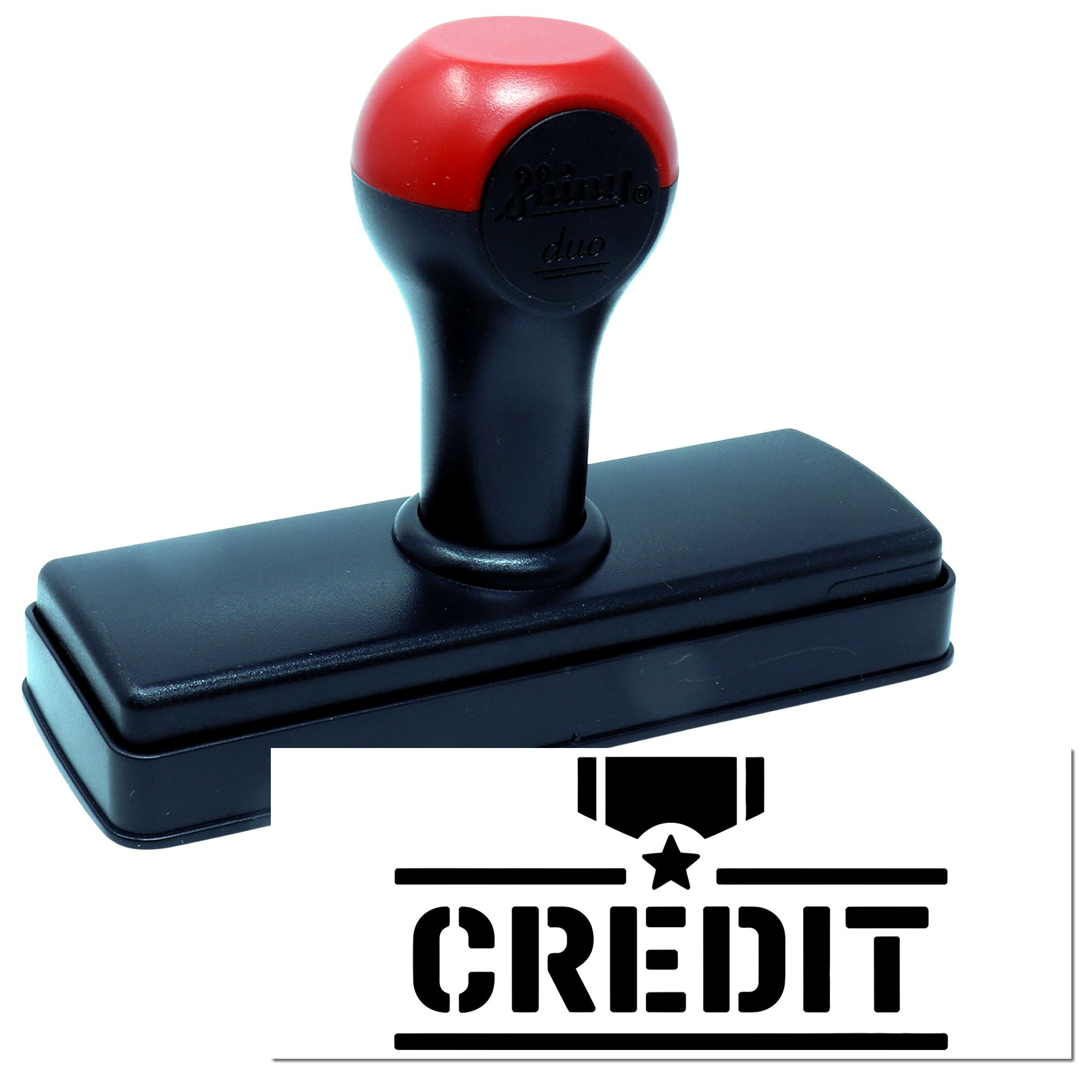 Red and black self-inking stamp and seal with rectangular base, showing a CREDIT imprint with star and bold lines.